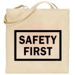 Na obrazku przedstawiono ecru torbę z czarnym napisem " SAFETY FIRST" - Torba BHP Proresult