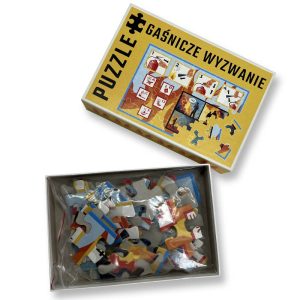 Na obrazku widać otwarte pudelko puzzle, w środku widać torebkę z puzzlami - Puzzle BHP Proresult