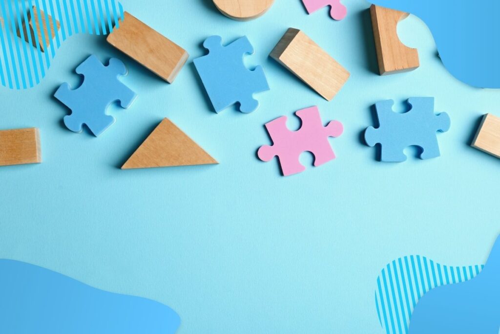 Rozsypane elementy puzzli na niebieskim tle - Proresult