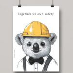 Na obrazku widać zawieszony minimalistyczny plakat z koalą w kasku oraz hasłem w języku angielskim- Plakaty BHP Proresult