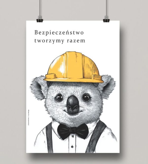 Na obrazku widać zawieszony minimalistyczny plakat z koalą w kasku oraz hasłem w języku polskim- Plakaty BHP Proresult