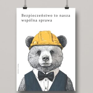 Na obrazku widać zawieszony minimalistyczny plakat z misiem w kasku oraz hasłem w języku polskim - Plakaty BHP Proresult